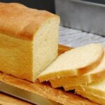 Homemade Chilean white sandwich bread, pan de molde, baked in a loaf pan with a golden crust