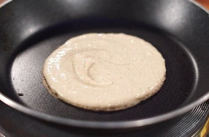 Cooking oat and banana pancakes in a nonstick skillet