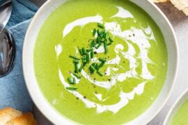 Homemade cream of spinach soup with ham and croutons