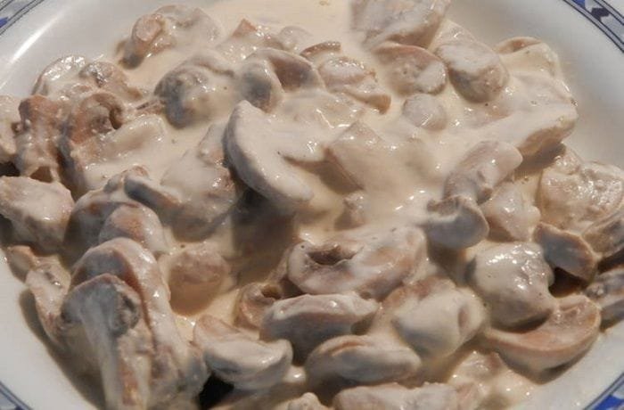Homemade creamy mushroom sauce served over beef, Chilean salsa de champiñones recipe