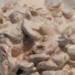 Creamy sliced mushroom sauce in a skillet