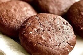 Soft chocolate cocoa cookies on a cooling rack