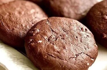 Soft chocolate cocoa cookies on a cooling rack