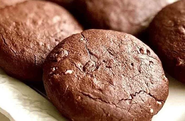 Soft chocolate cocoa cookies on a cooling rack