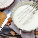 Smooth homemade bechamel sauce in a pan