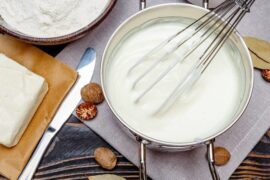 Smooth homemade bechamel sauce in a pan