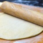 Ball of easy homemade pizza dough on a floured surface