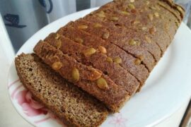 Homemade flaxseed and chia bread, sliced to show its seeded crumb