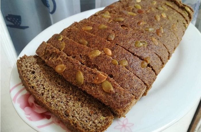 Homemade flaxseed and chia bread, sliced to show its seeded crumb