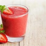 Glasses of fresh homemade strawberry juice with ice