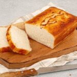 Fluffy gluten free rice flour bread baked in a loaf pan and sliced