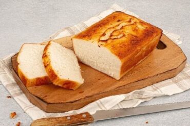Fluffy gluten free rice flour bread baked in a loaf pan and sliced