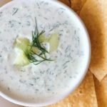 Greek yogurt, mayonnaise, and chive sauce in a bowl