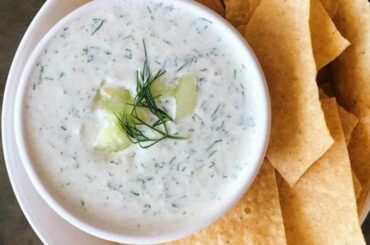 Greek yogurt, mayonnaise, and chive sauce in a bowl