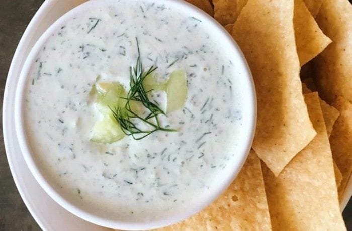 Greek yogurt, mayonnaise, and chive sauce in a bowl