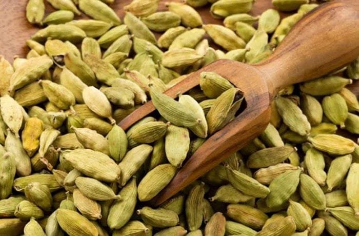 Green cardamom pods used to infuse golden milk