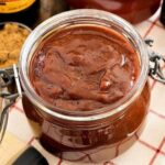 Homemade barbecue sauce in a jar, dark and glossy