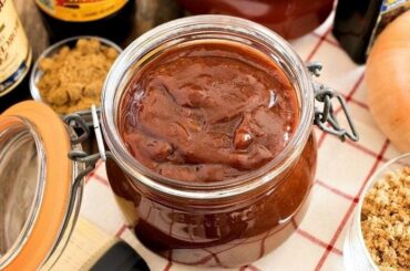 Homemade barbecue sauce in a jar, dark and glossy