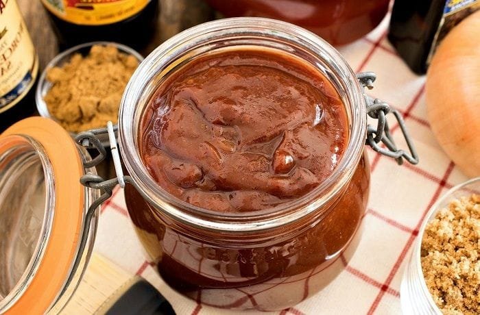 Homemade barbecue sauce in a jar, dark and glossy