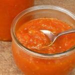 Homemade carrot jam in a glass jar