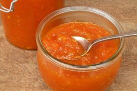 Homemade carrot jam in a glass jar