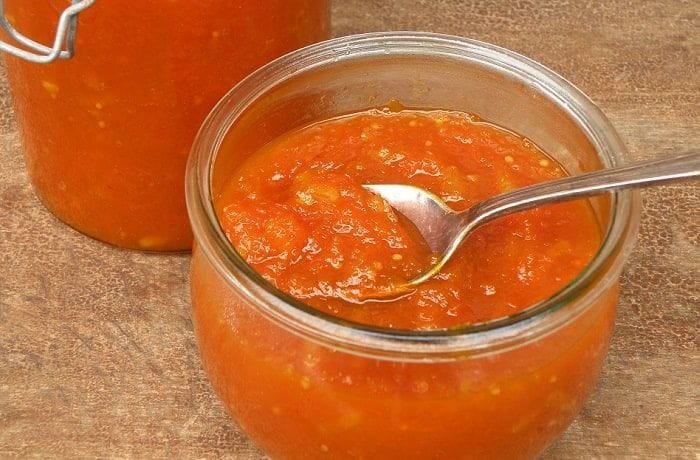 Homemade carrot jam in a glass jar