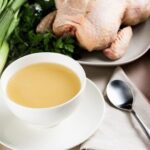 Homemade chicken broth in a bowl