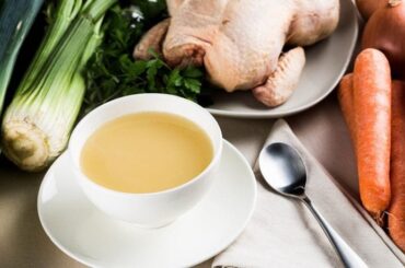 Homemade chicken broth in a bowl