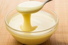 Homemade sweetened condensed milk in a jar