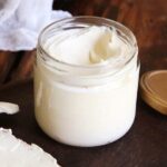Homemade cream cheese spread in a glass jar with toast