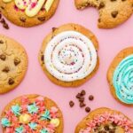 Homemade Crumbl style pink sugar cookies with swirled pink buttercream frosting