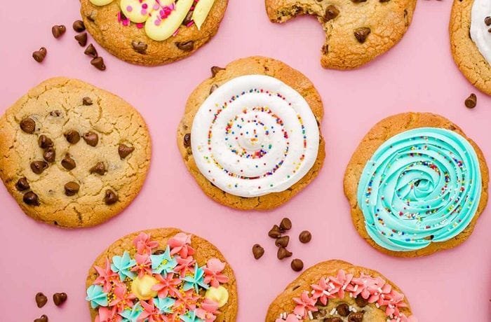 Homemade Crumbl style pink sugar cookies with swirled pink buttercream frosting