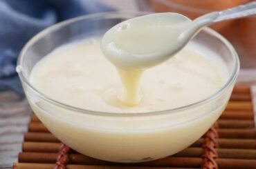 Homemade evaporated milk in a glass jar