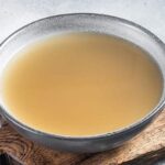 Homemade fish stock fumet in a pot