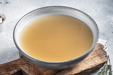 Homemade fish stock fumet in a pot