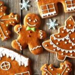 Homemade gingerbread cookies cut into Christmas shapes and decorated with icing