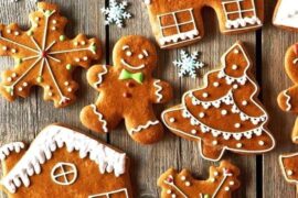 Homemade gingerbread cookies cut into Christmas shapes and decorated with icing