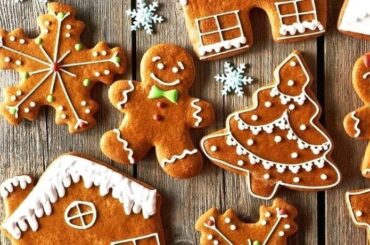 Homemade gingerbread cookies cut into Christmas shapes and decorated with icing