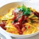 Homemade ravioli filled with ham, ricotta, and cheese