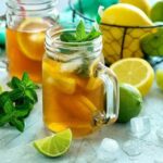 Homemade iced tea with lemon slices and mint