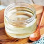 Homemade invert sugar syrup in a glass jar