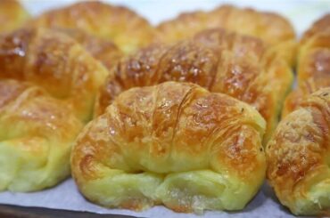 Homemade medialunas, glossy sweet South American croissants