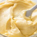 Smooth homemade pastry cream with vanilla in a bowl