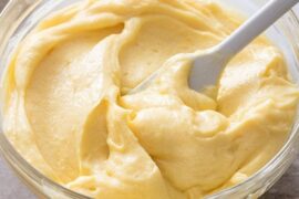 Smooth homemade pastry cream with vanilla in a bowl