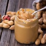 Homemade natural peanut butter in a jar