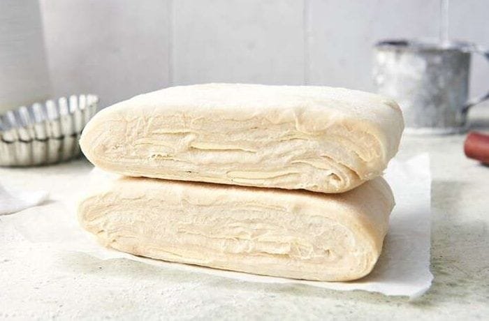 Homemade puff pastry dough showing its laminated layers