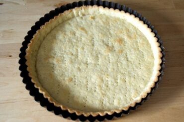 Homemade shortcrust quiche base pressed into a tart pan