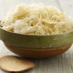 Homemade sauerkraut, fermented shredded cabbage, in a glass jar