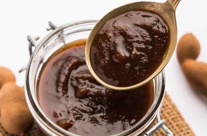 Homemade sweet and sour tamarind sauce in a bowl