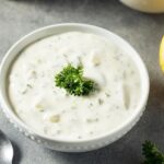Homemade tartar sauce with mayonnaise, pickles, onion, and parsley